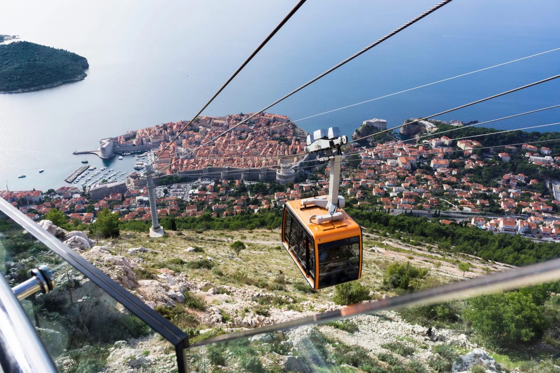 Cable car above Dubrovnik overlooking the walled city and Adriatic Sea.