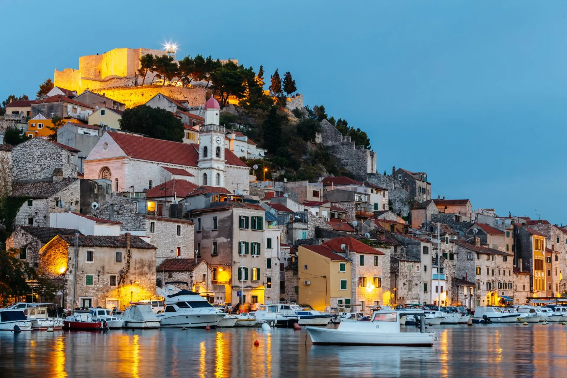 Evening view of the historical part with old houses and St. Michael's fortress in Sibenik, Croatia